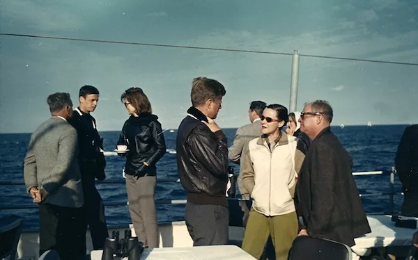 George Plimpton (second from left) hanging out with Jackie Kennedy (third from left) and JFK (center).