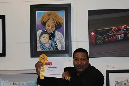George Rivera, a winner at 2014s National Arts Program, poses with his painting Mama and Mana.