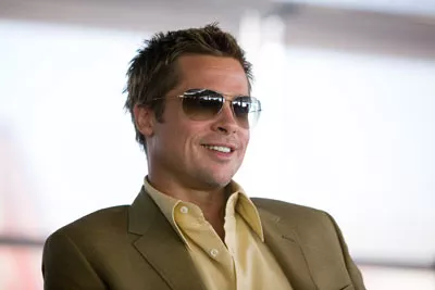 GRIN AND BEAR IT: Rusty Ryan (Brad Pitt) enjoys the con in Ocean's Thirteen ...