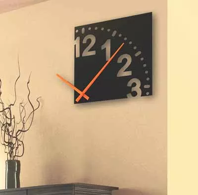 Home Eclectic - The Infinity wall clock, 12 in diameter, black background with orange hands, makes a great conversation piece. Retail $39.99 - 601 S. Kings Drive. 704-332-4346 - Open 7 days a week - www.home-eclectic.com - Credit cards accepted