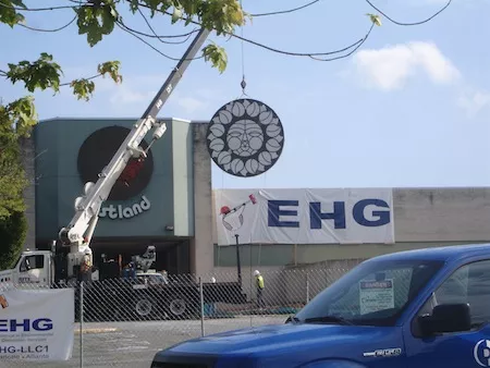 In September, crews hauled away the old malls Rising Sun signs for preservation.