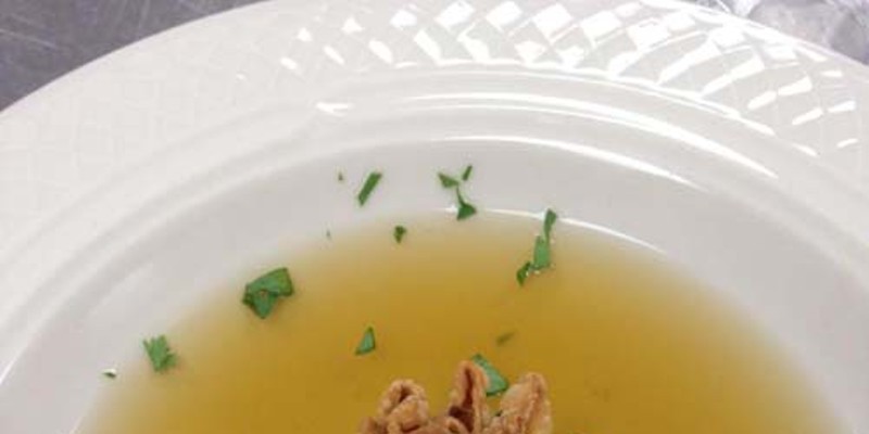 Infused herb broth with chicken liver mousse dumpling — just one of the dishes to be served at the Locally Twisted Dinner