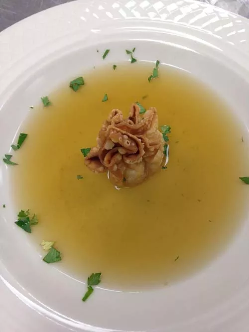 Infused herb broth with chicken liver mousse dumpling — just one of the dishes to be served at the Locally Twisted Dinner