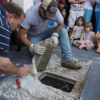Large crowd shows up for time capsule opening, finds box full of sludge
