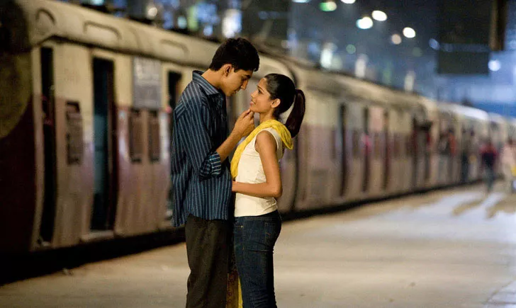 LOVE ON TRACK: Jamal (Dev Patel) and Latika (Freida Pinto) in Slumdog Millionaire. - FOX SEARCHLIGHT