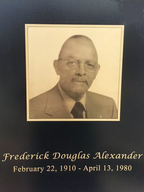 Metal-plate photographs are attached to several of the columns on the main bridge of Fred D. Alexander Highway