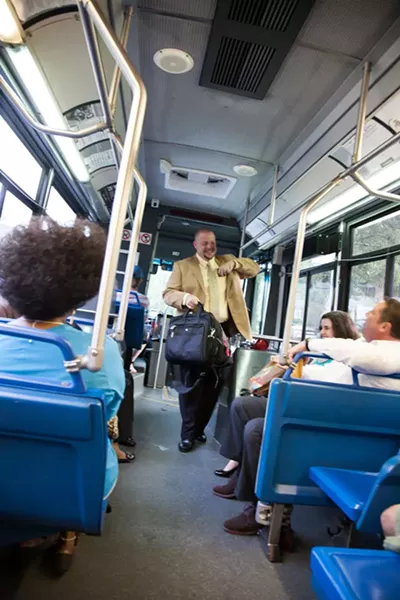 Michael Schiavo has a car at home, but he takes the bus to work to avoid paying Uptown parking fees. (Photo: Joe Martin)