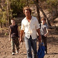 MUD IS THICKER THAN WATER: Neckbone (Jacob Lofland), Mud (Matthew McConaughey) and Ellis (Tye Sheridan) search for ways to get a land-bound boat to the river in Mud. (Photo: Roadside Attractions)