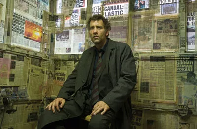 NEWS OF THE DAY Theo (Clive Owen) follows the paper trail in Children of Men. - JAAP BUITENDIJK / UNIVERSAL