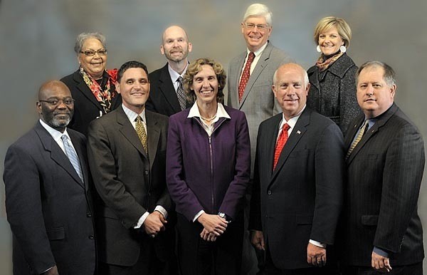 One big happy dysfunctional family: The Mecklenburg County Commission. Roberts is front and center; Cogdell is to her left, mimicking her pose. Watch that figurative knife, Jen!