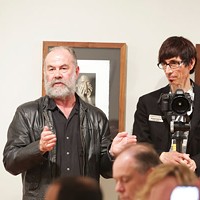 Phil Moody, photography professor at Winthrop University, standing with Mitchell Kearney at an October meeting of the members of The Light Factory