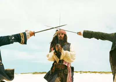 SHAKY SWORDPLAY Jack Sparrow (Johnny Depp) laments that it takes three to tangle in Pirates of the Caribbean: Dead Man's Chest