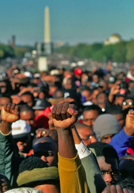 The crowd reacts to Minister Louis Farrakhan's speechs at the Million Man March on October 17, 1995. - DENNIS BRACK/NEWSCOM