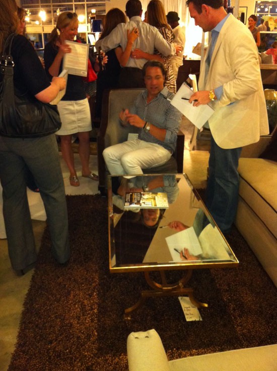 Thom Filicia signs books for his adoring fans. (Dont you just love the mirrored coffeetable?)