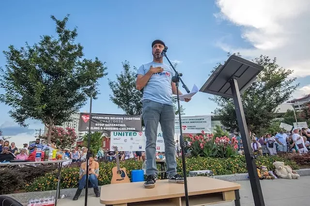 Hector Vaca speaks at the End the War in Immigrants vigil.