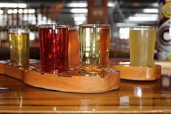 Two flights of cider on custom-made flight paddles at Red Clay.