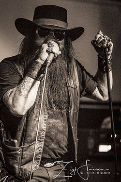 Moss belts it out. (Photo Courtesy of Johnny Moss)