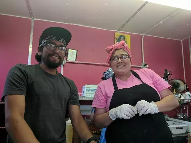 Eric Garcia (left) and Yvette Gomez in the truck.