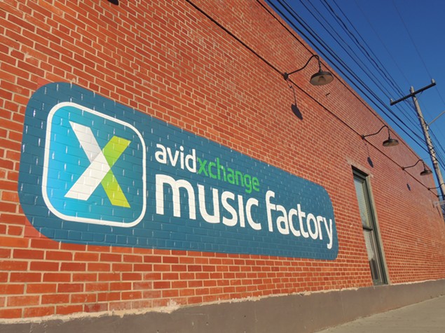 The logo, as painted on the side of Small Bar, for the newly-named AvidXchange Music Factory. - RYAN PITKIN