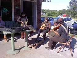 An impromptu jam session outside Tommy's Pub.