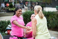 Planned Parenthood staff speaking with a resident at a recent event.