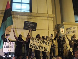 Protesters at CMPD headquarters in the days following Scott's shooting.