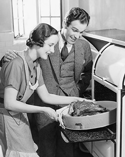 couple-in-kitchen_-wife-taking-roast-from-oven-_b_w_-72131201_2818x3534.jpg