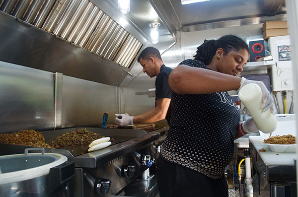 Employees cook up some delicious halal grub. Photo by Allison Braden.