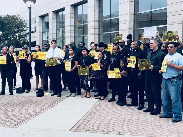 Community members gathered to demand answers after body cam footage showed Ruben Galindo's arms were up when he was killed by CMPD officers on Sept. 6. (Photo by amalia deloney)