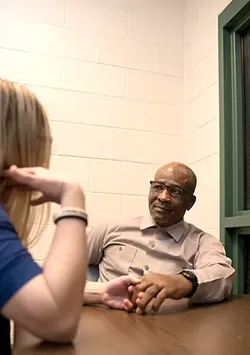 Ronnie Long and wife Ashleigh talk during Ronnie’s visitation at the Albemarle Correctional Institute on Thursday, Feb. 1, 2018. (photo by Caitlin Penna)
