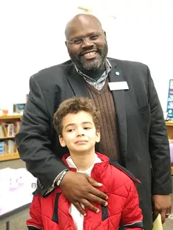 Ray with one of his sons.