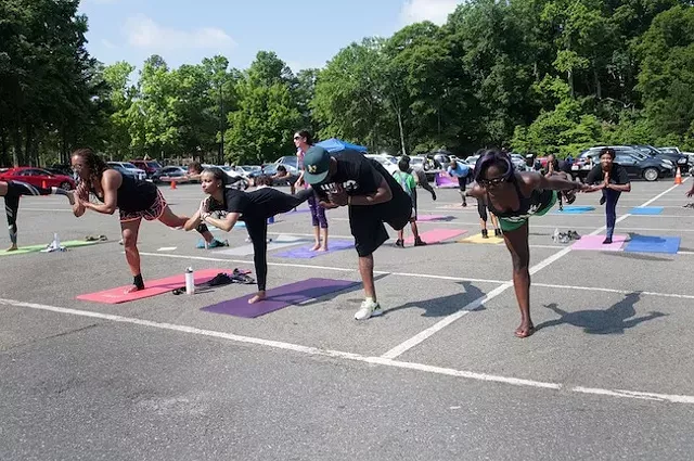 Doing yoga at last year's walk. (Photo by Jon Strayhorn)