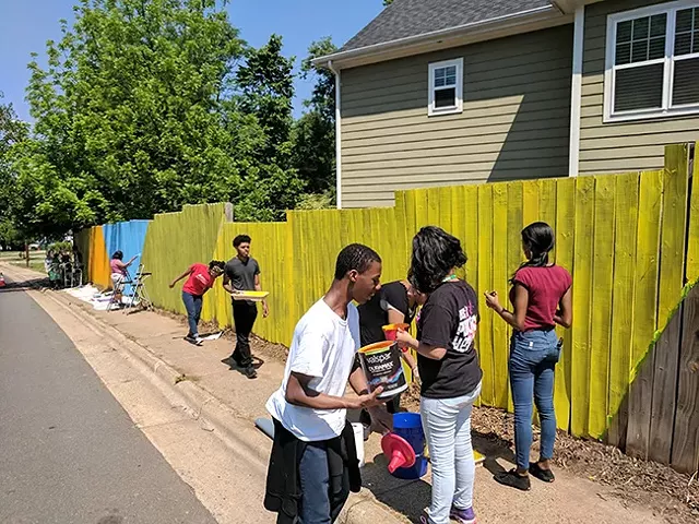 Students worked on the background for three hours on Saturday, but will continue to add to it until November. (Photo by Ryan Pitkin)