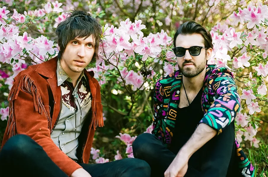 Glade (left) and Olson are among the flower people. (Photo by Bridgette Aikens)