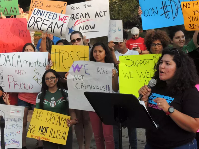 Stefania Arteaga of Comunidad Colectiva addresses a crowd at Tuesday's rally.