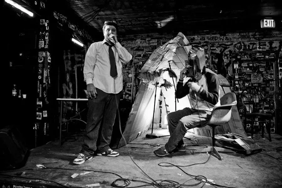 $crilla — Fred Rock (left) and somebody wearing a mask — at the Milestone.