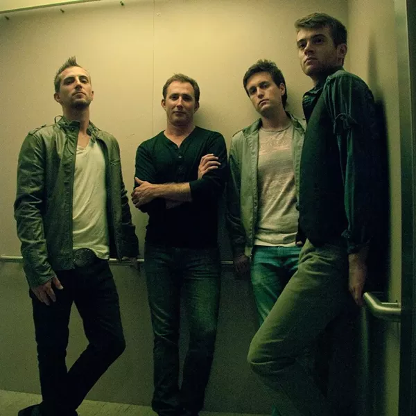Eller, left, and Stewart, next to him, in The Air Station. Singer Andrew Palmer is second from right.