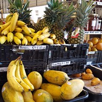 Non-local items including bananas and pineapples can be found near the N.C.-grown produce. (Photo by Alison Leininger)