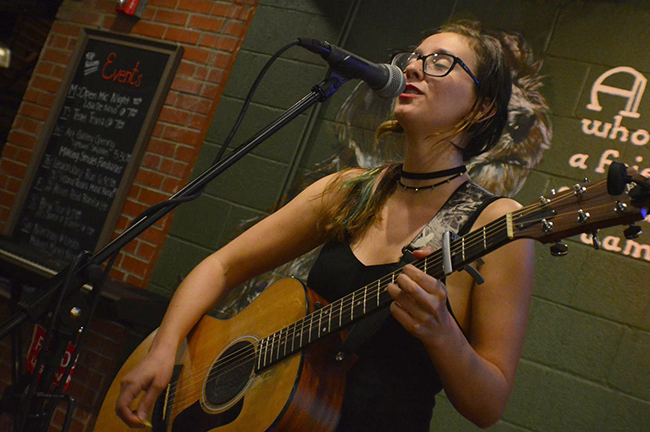 Lisa De Novo performs at her open mic night. (Photo by Jimmy Ski Photography)