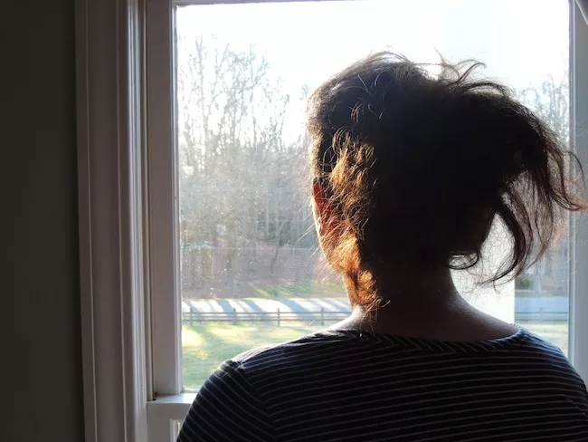 Emily, a victim of sexual assault and the subject of an episode of 'She Says,' in her home in 2017. (Photo by Ryan Pitkin)