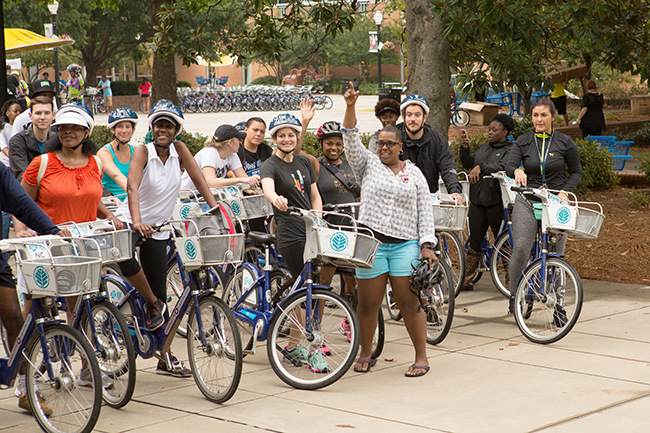 Dianna Ward (in blue shorts) gets ready to leave during a recent back-to-school ride at Johnson C. Smith University. (Photo by Michael Hernandez)