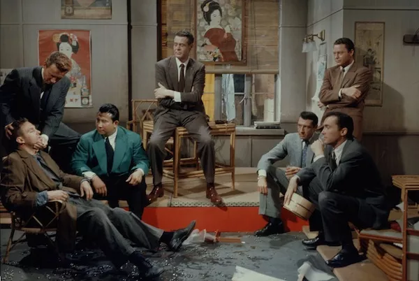 Robert Stack (seated left), Robert Ryan (center), Robert Quarry (seated right) and DeForest Kelley (standing right) in House of Bamboo (Photo: Twilight Time)