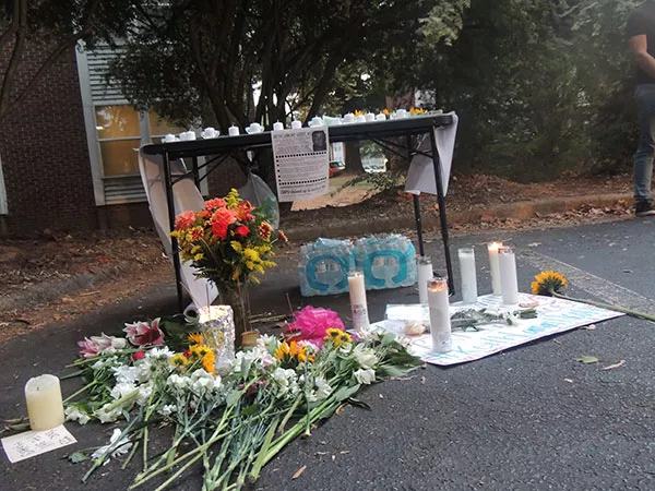 A memorial to Keith Lamont Scott in the parking lot where he was killed. - RYAN PITKIN