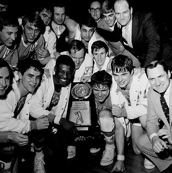 The team poses with the 1968 NCAA Regional Trophy. - HUGH MORTON