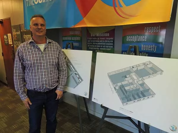 Rodney Tucker with sketch plans for the new TOY space on Monroe Road.