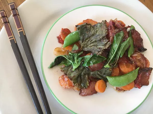 Hmong style fried squash leaf stir fry. (photo by Ari Levaux)