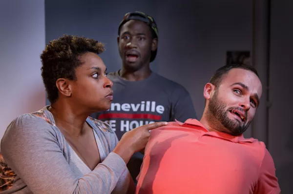 Ericka Ross gets all up in Stephen Seay's business while Kevin Aoussou looks on from behind. (Photo by Chuck Bludsworth)