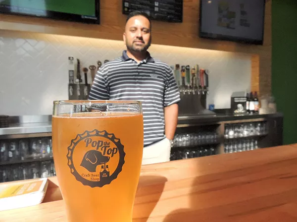Ketan Patel in the shop he owns with his wife. (Photo by Ryan Pitkin)