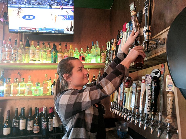 Mandy Smart working at the restaurant in SouthPark where she tends bar and serves. (Photo by Ryan Pitkin)