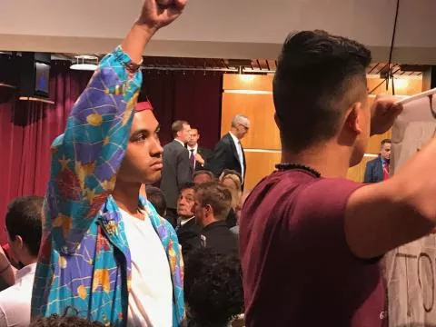 Quisol (left) and fellow students during the DeVos protest at Harvard.